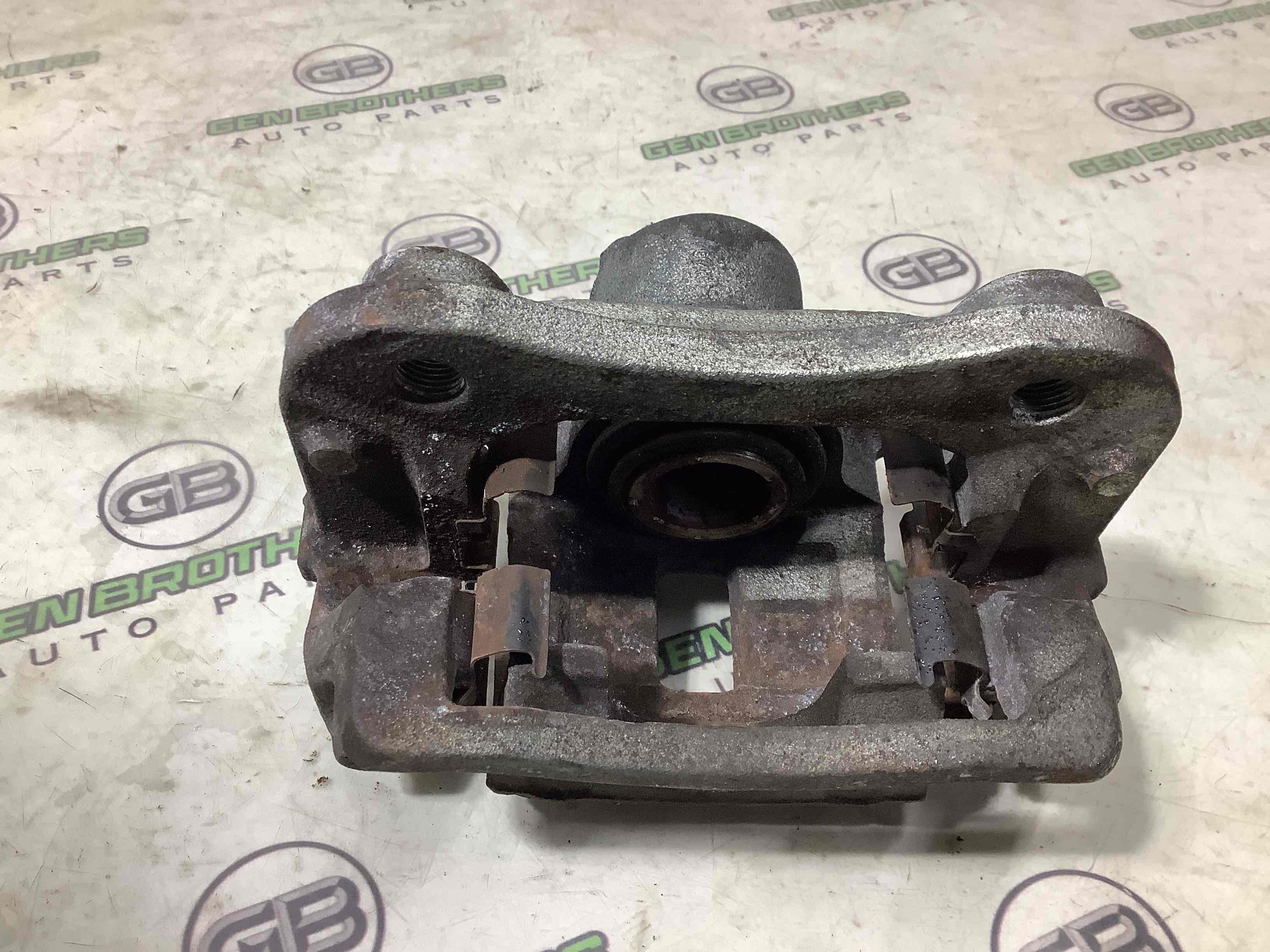 Супорт задній лівий