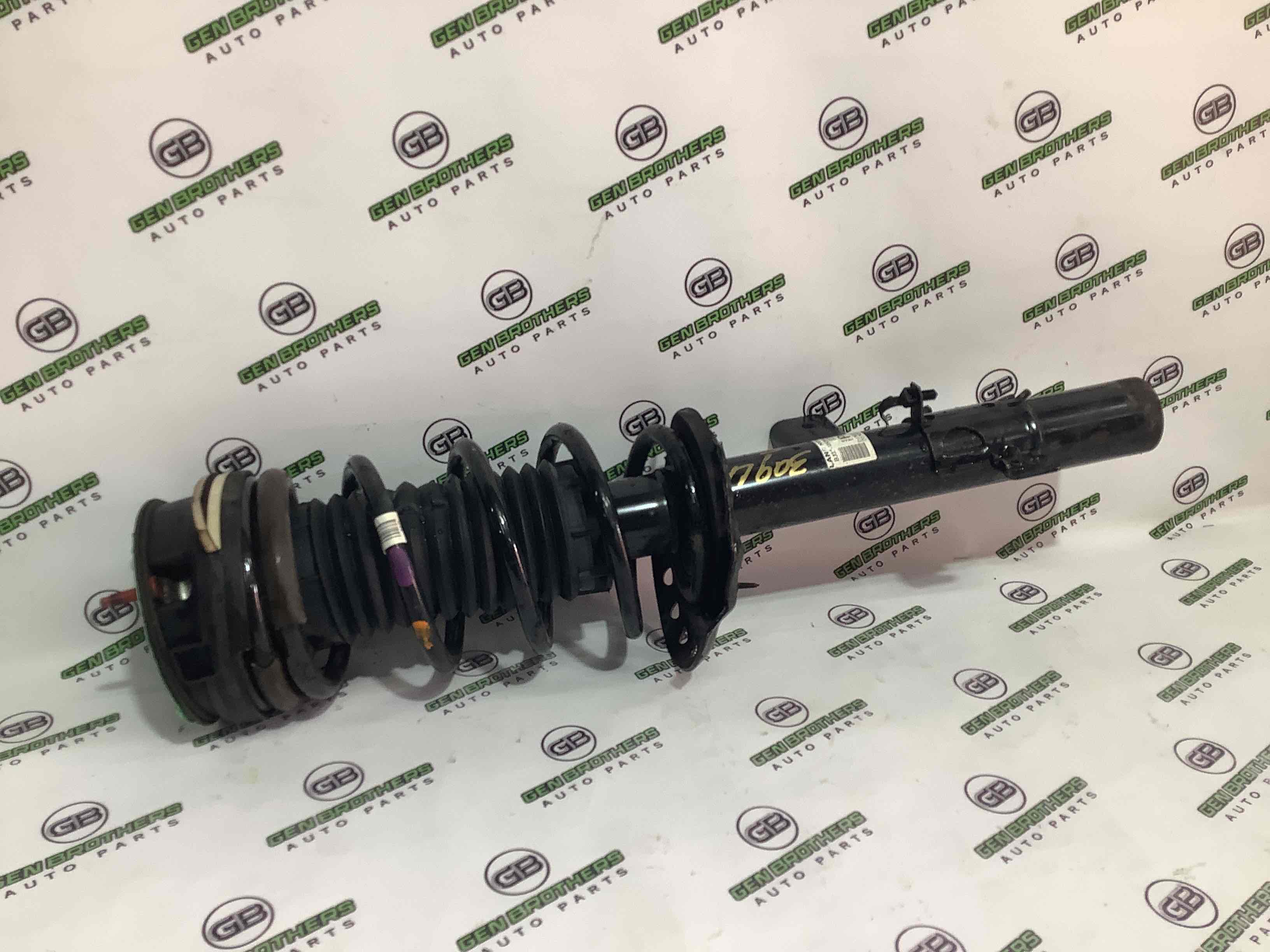 Амортизатор задній лівий