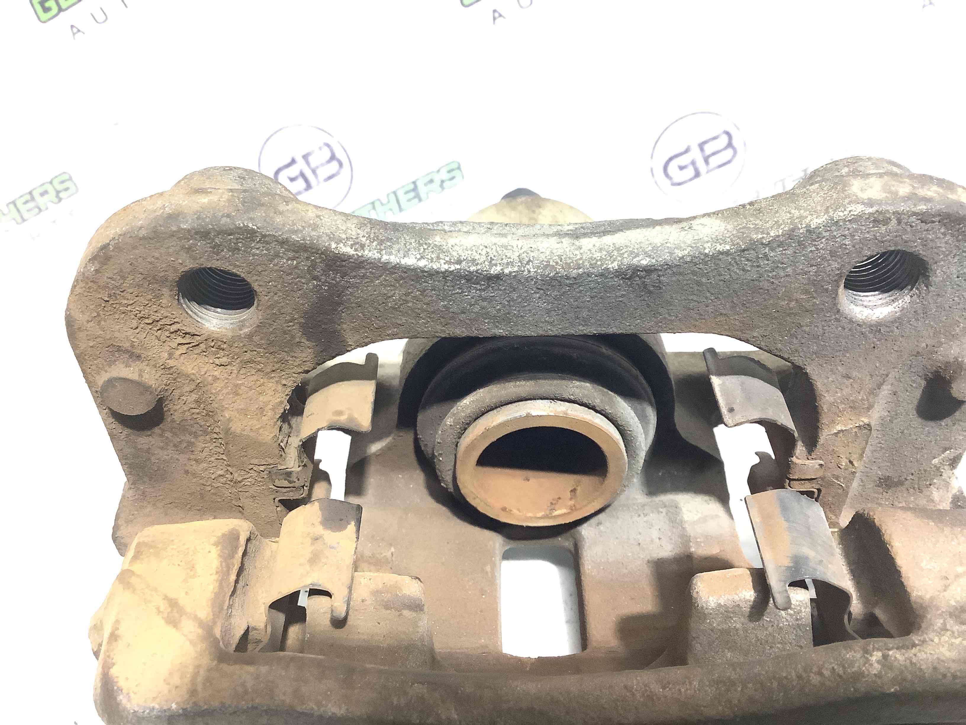 Супорт задній лівий