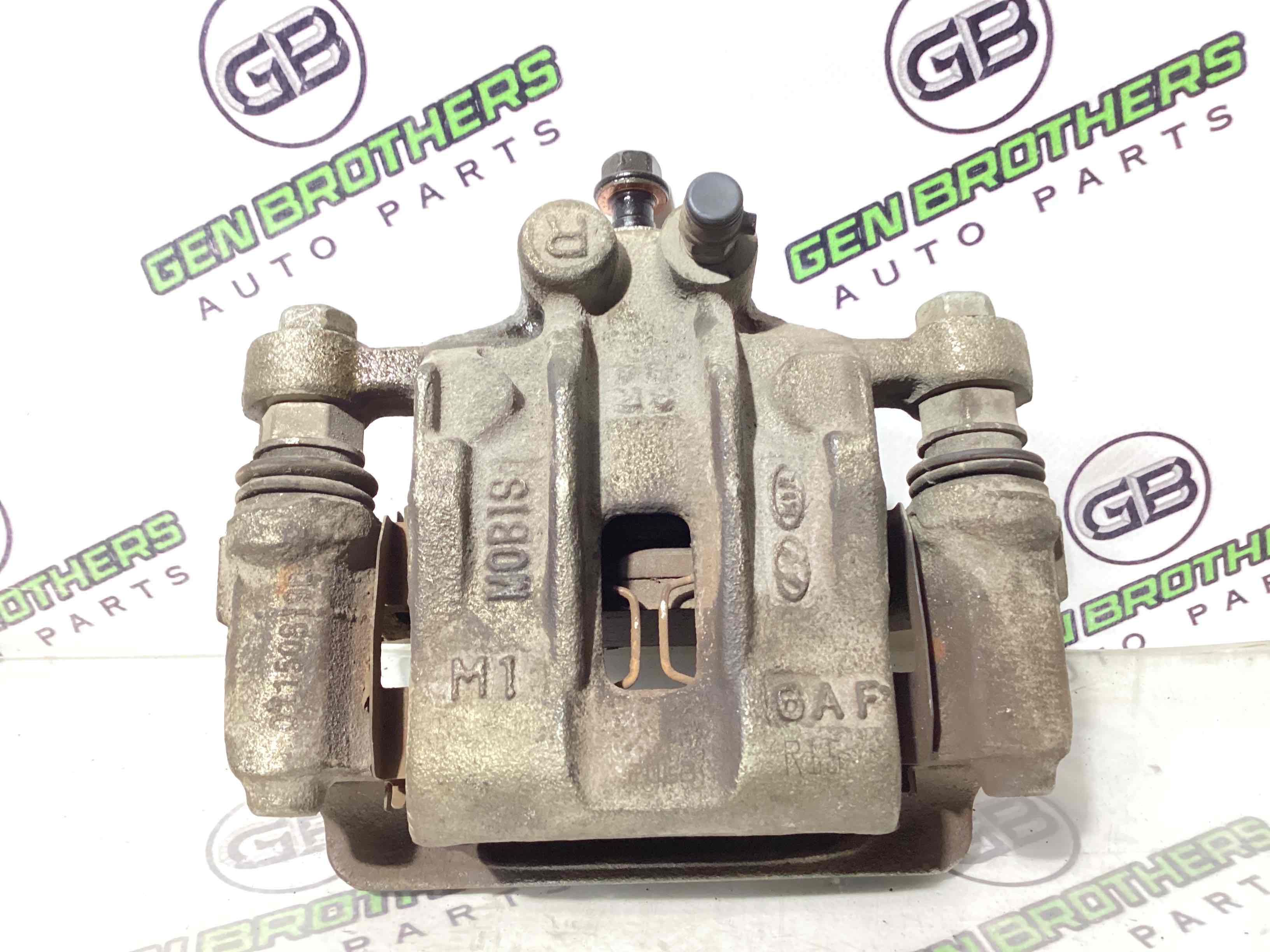 Супорт задній правий