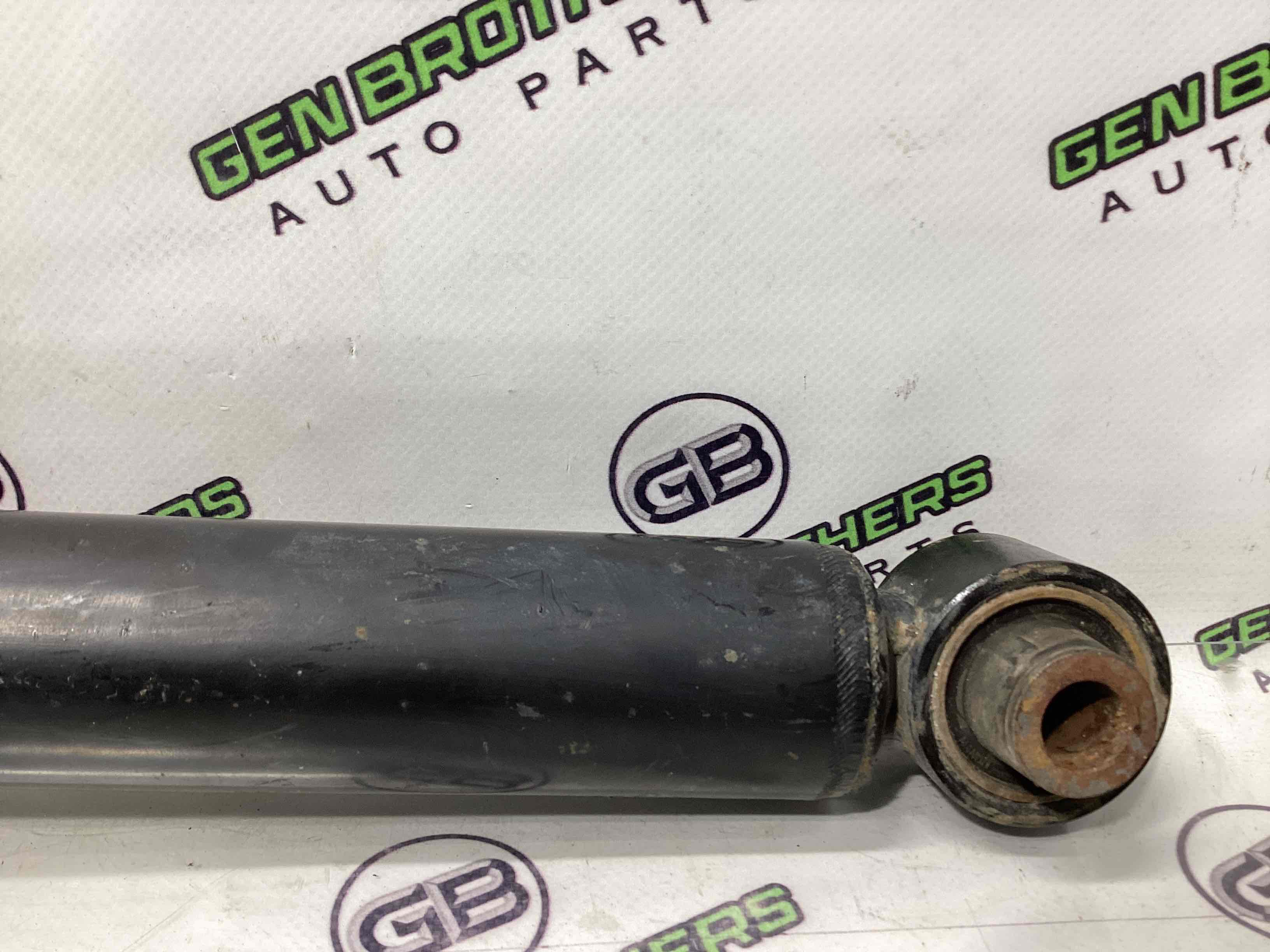 Амортизатор задній лівий