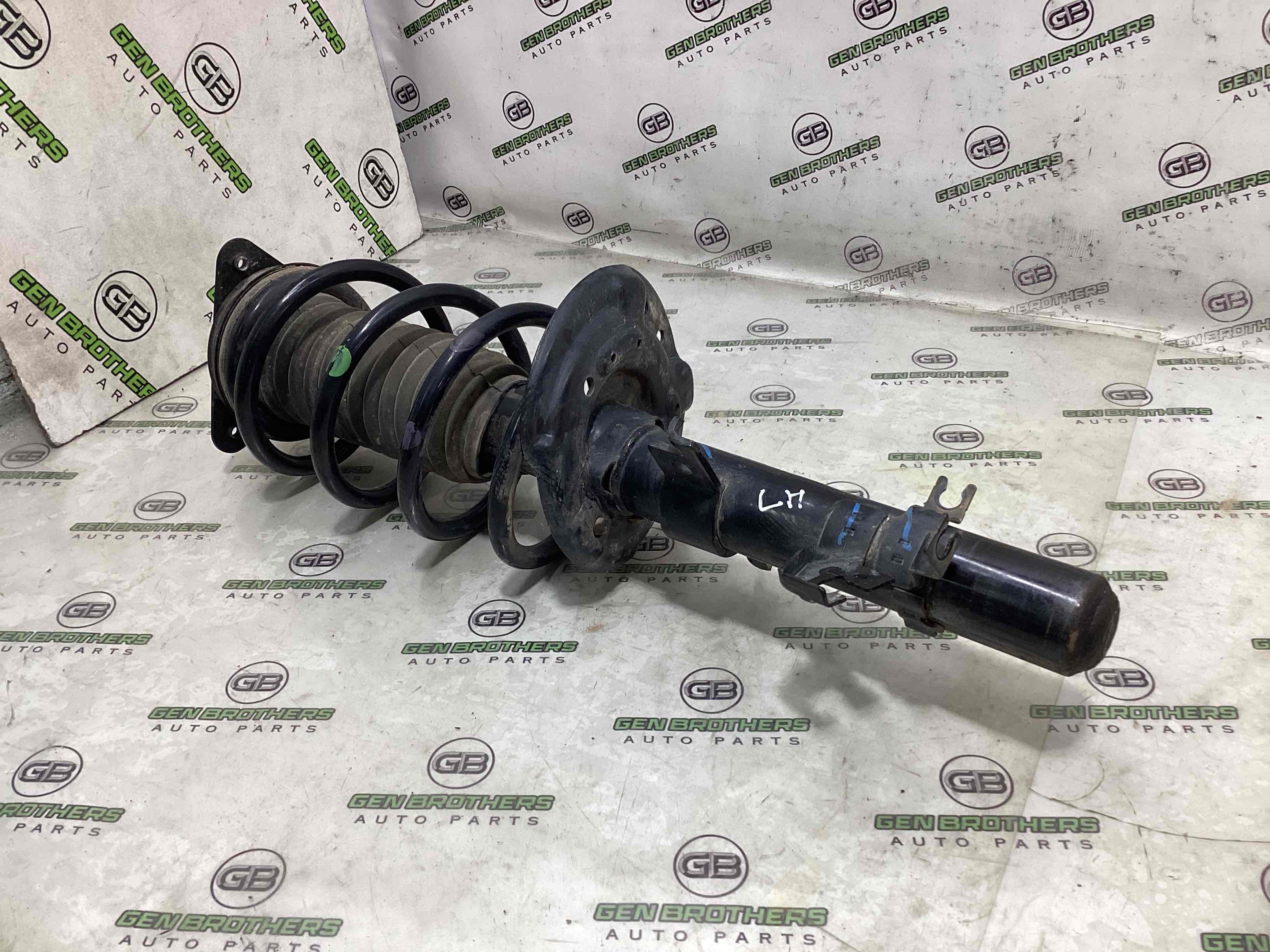 Амортизатор передній лівий