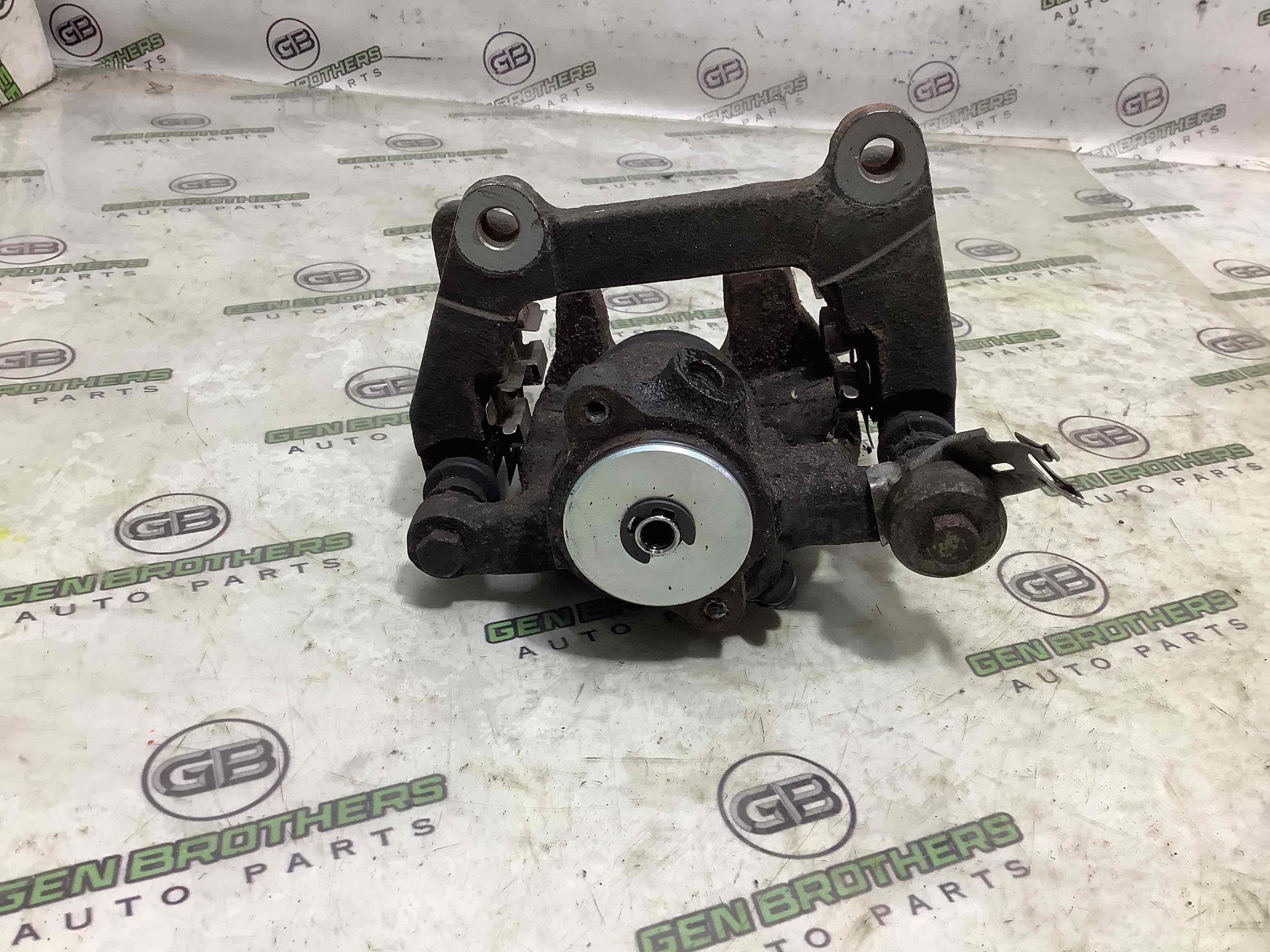 Супорт задній лівий