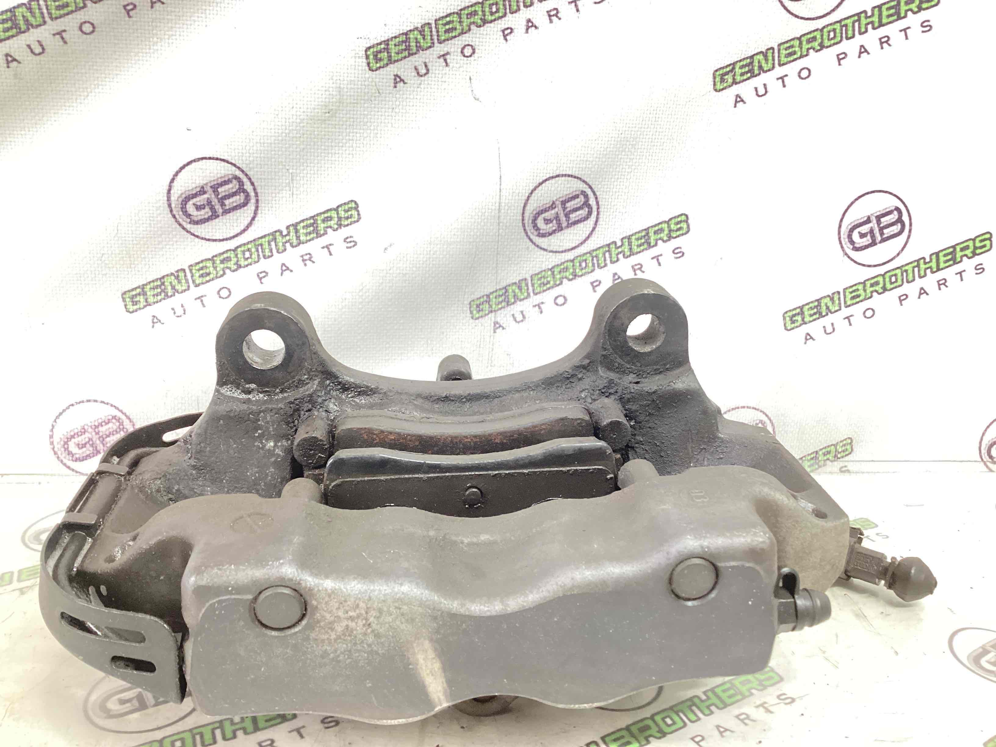 Супорт задній правий